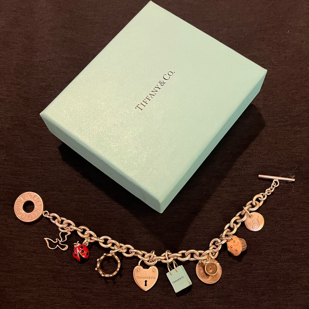 Tiffany $ Co Silver charm bracelet.